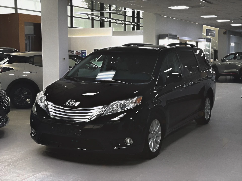 Black minivan used for family and group transfers Black minivan used for family and group transfers